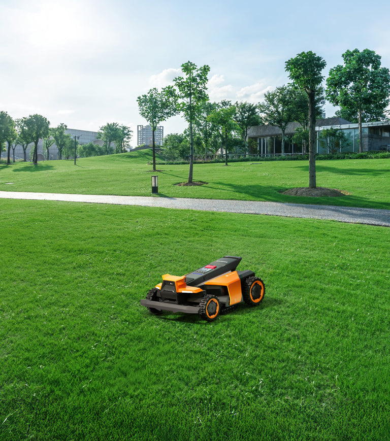 Navimow i110N robot lawn mower sits on the green lawn.