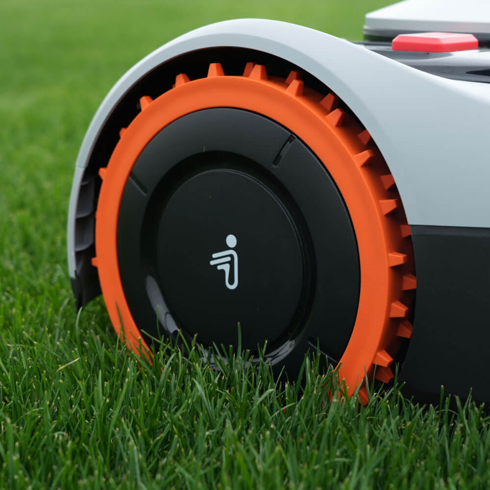 Navimow i110N robot lawn mower on a healthy green field.