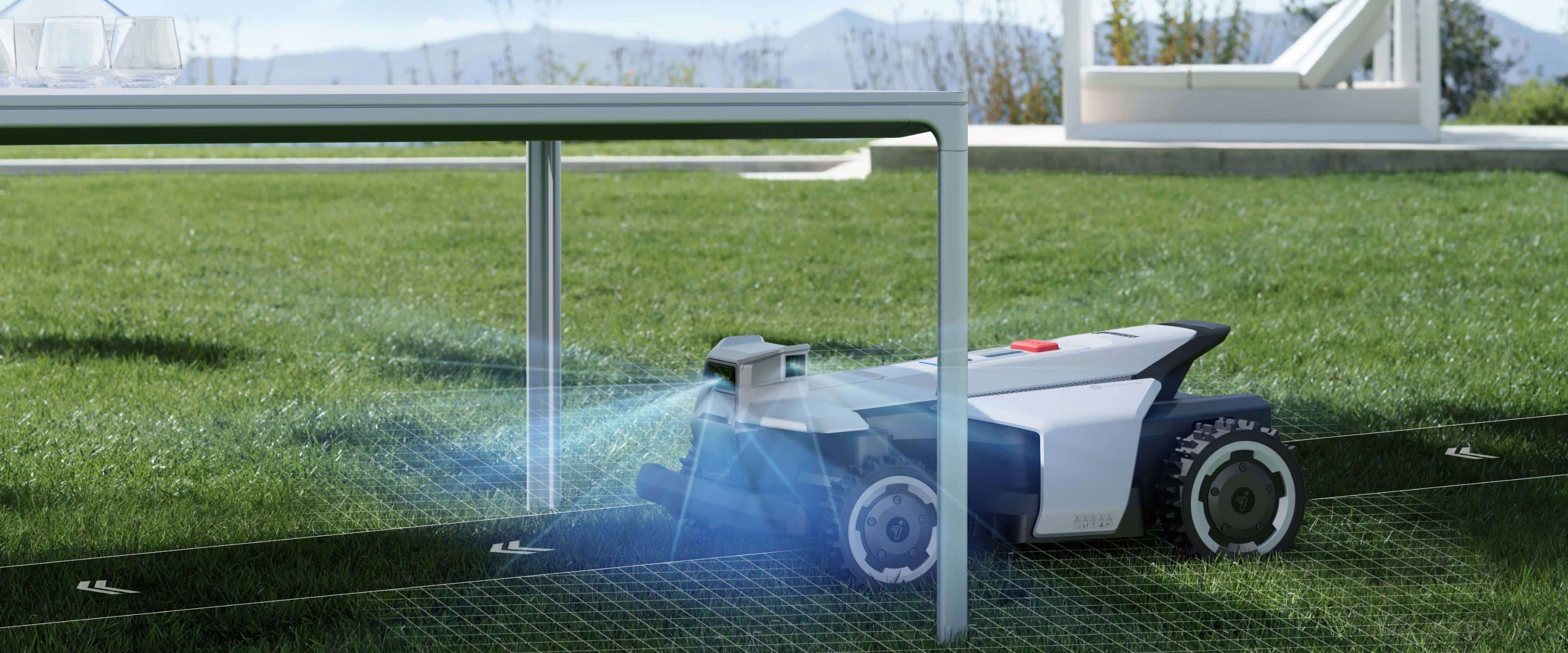 Segway Navimow i110N robot lawn mower mows grass under table.