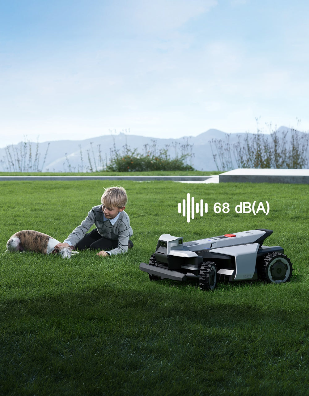 Navimow i110N robot lawn mower mows grass near boy dog.