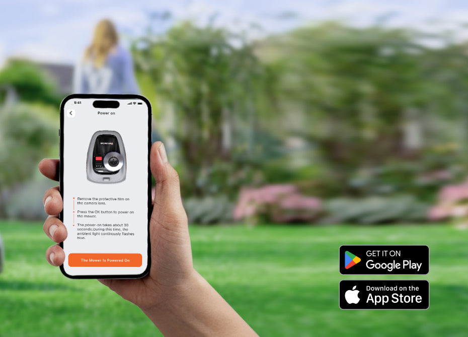 Hand holding phone with Navimow i Series robot lawn mower.