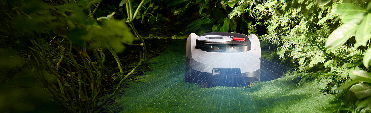 Navimow i110E robot lawn mower is scanning a lush garden.