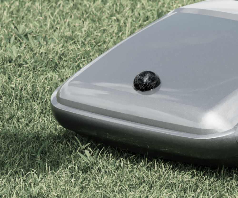 Navimow i Series robot lawn mower on a green lawn.