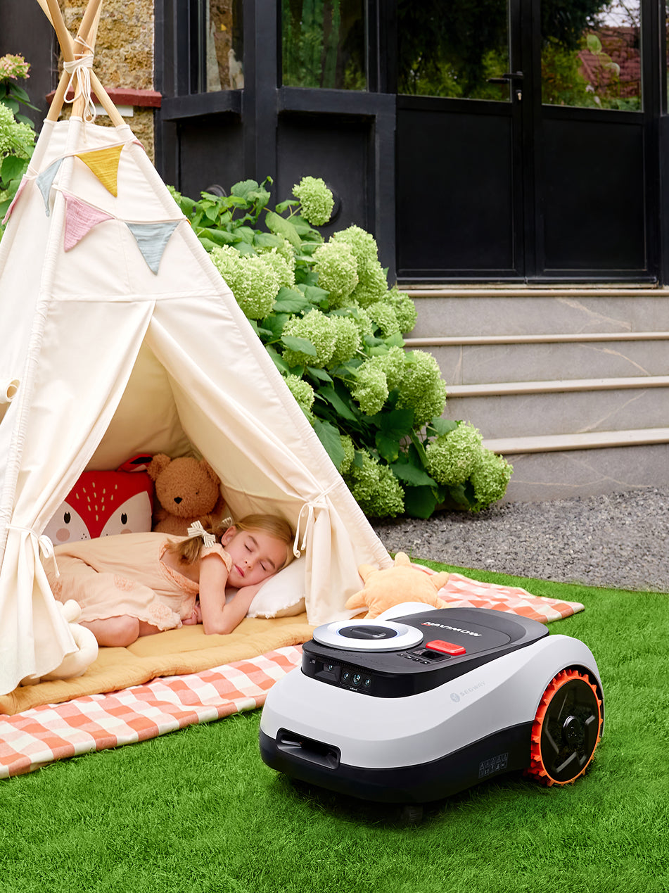 Segway Navimow i110E robot lawn mower on the green grass.