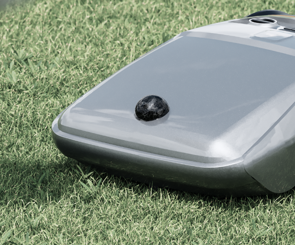 Navimow i110E robot lawn mower sits on a green lawn.