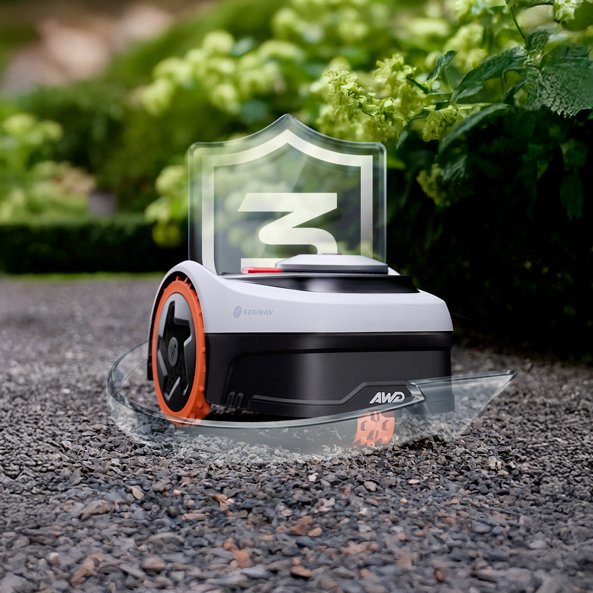 Segway Navimow i110N AWD robot lawn mower on gravel path.