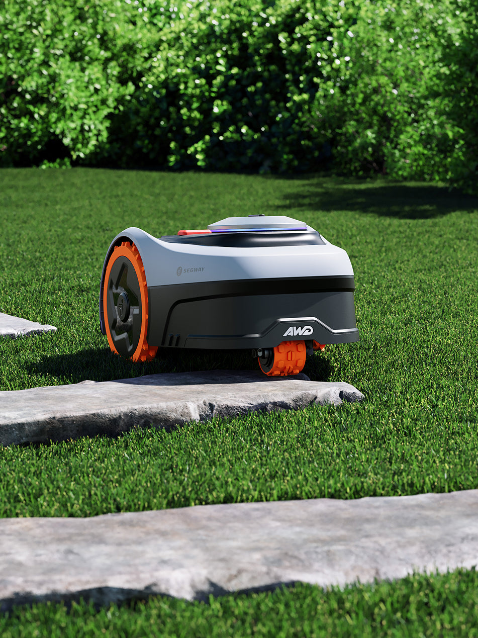 Segway Navimow X3 AWD robot lawn mower on green grass.