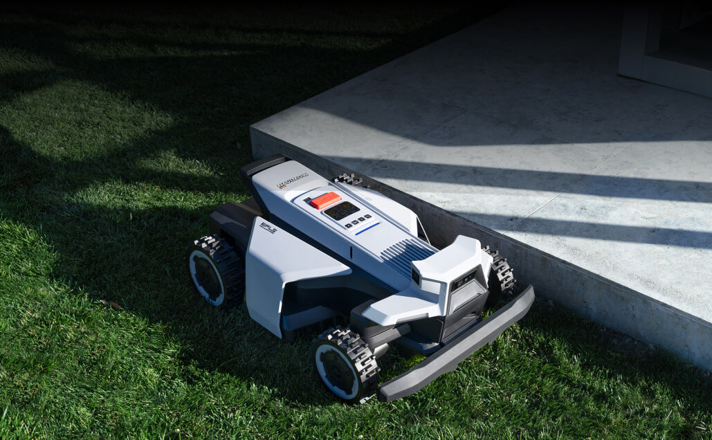 Navimow i110N robot lawn mower on the bright green grass.